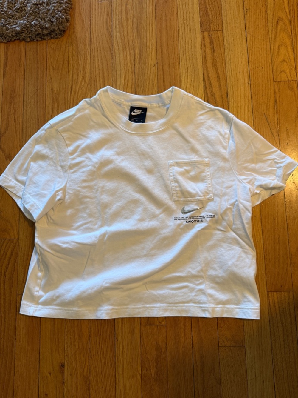 Nike White Pocket T-Shirt with Small Text Swoosh
